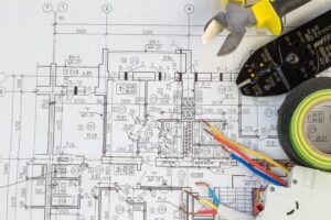 Tools next to electrical design drawing plan