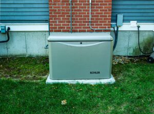 Residential generator on concrete pad in backyard