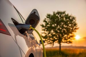 Electric car plugged into charger