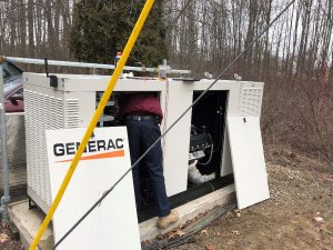 Service Technician Repairing Commercial Generator